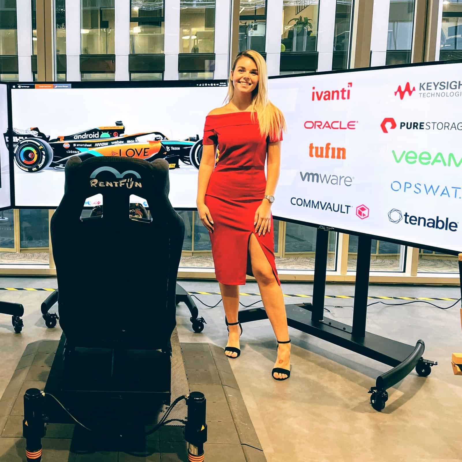 RoarFun Clients Arrow Formula 1 sponsor McLaren team immersive simulators with Love Nice lady in red at Arrow Forum