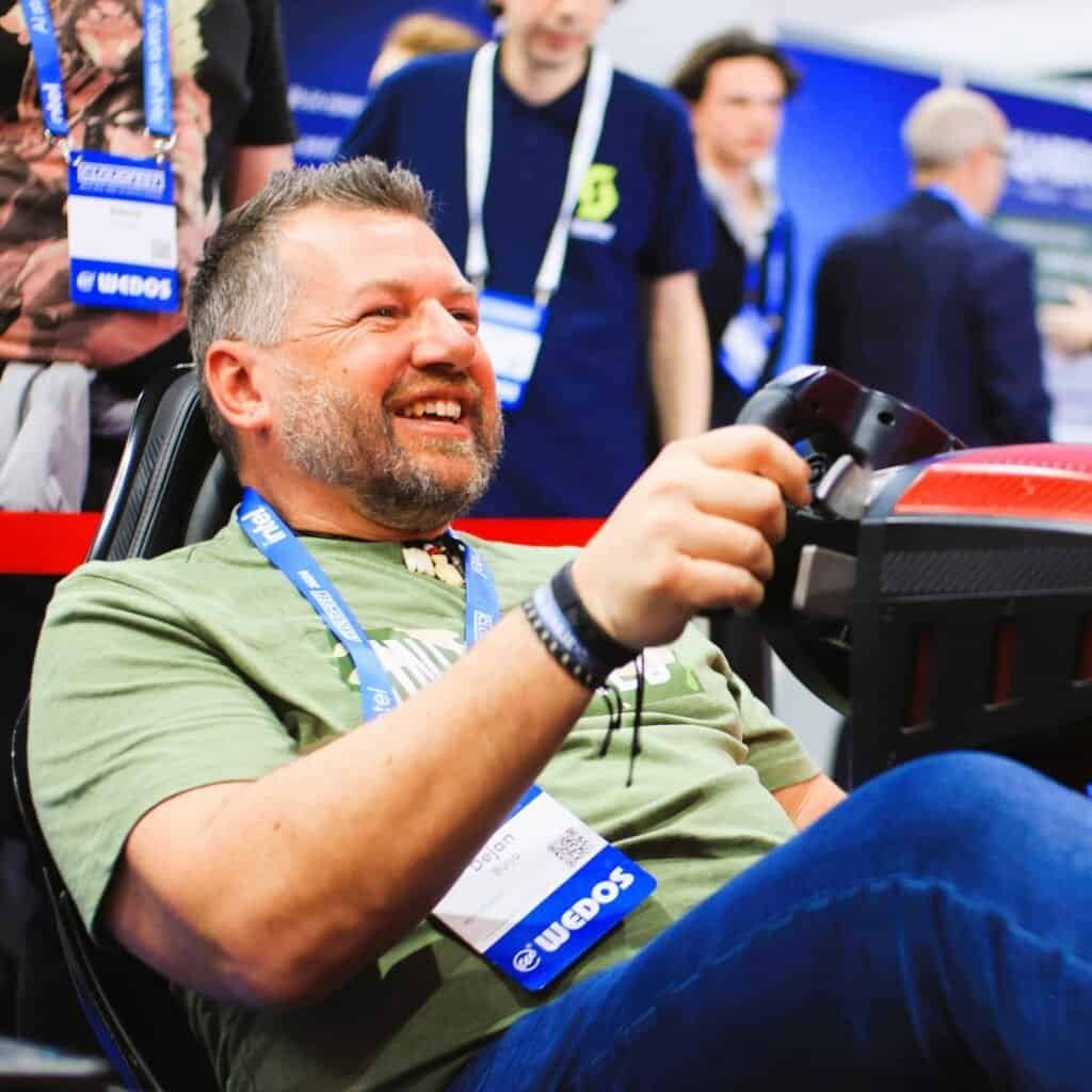 Happy people at cloudfest formula motion simulator from RoarFun.