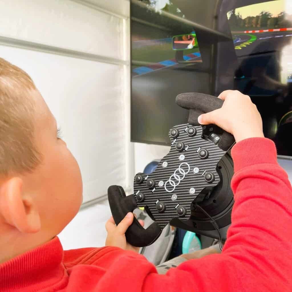 Audi racing steering wheel with our race sims rental.